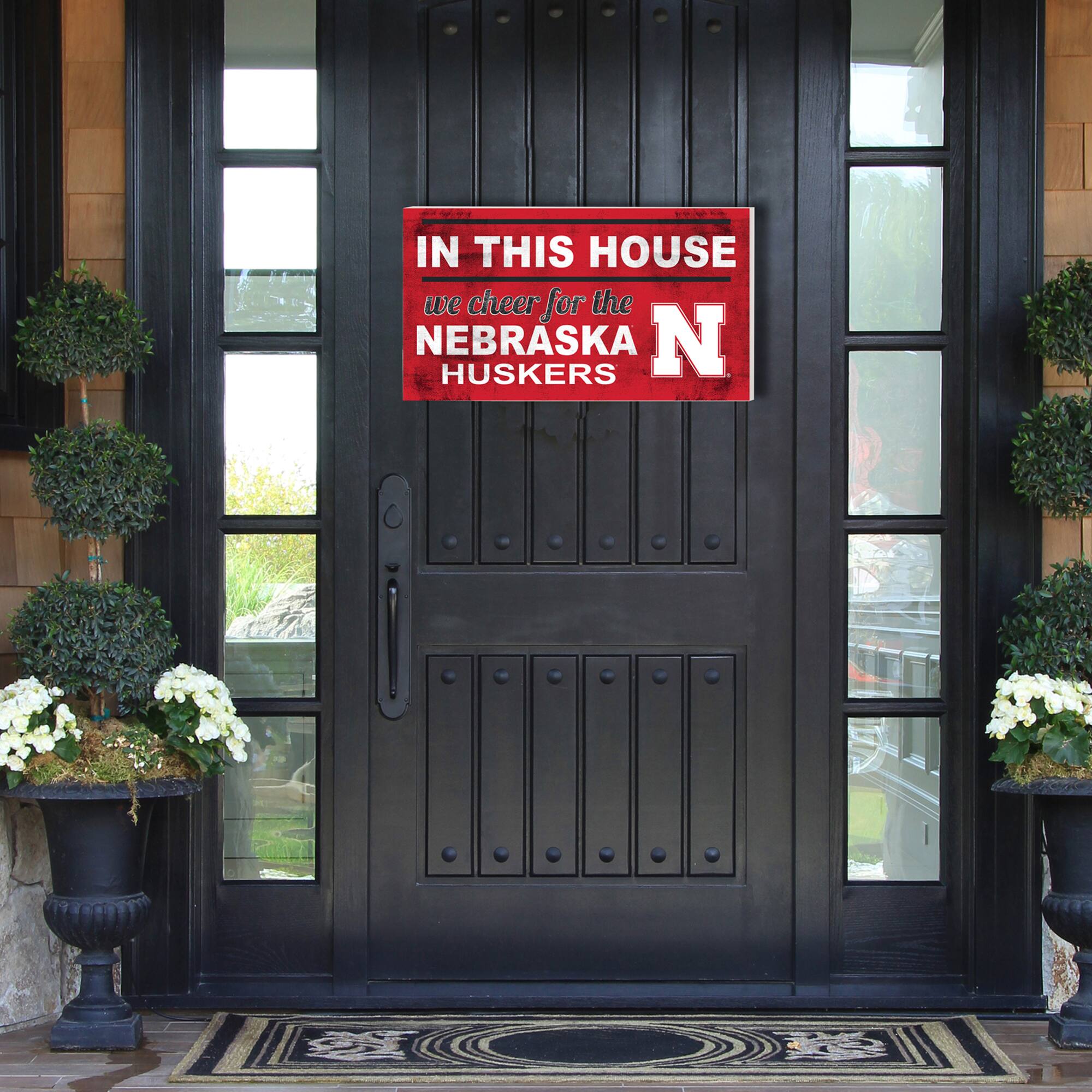IN THIS HOUSE  
we cheer for the NEBRASKA HUSKERS