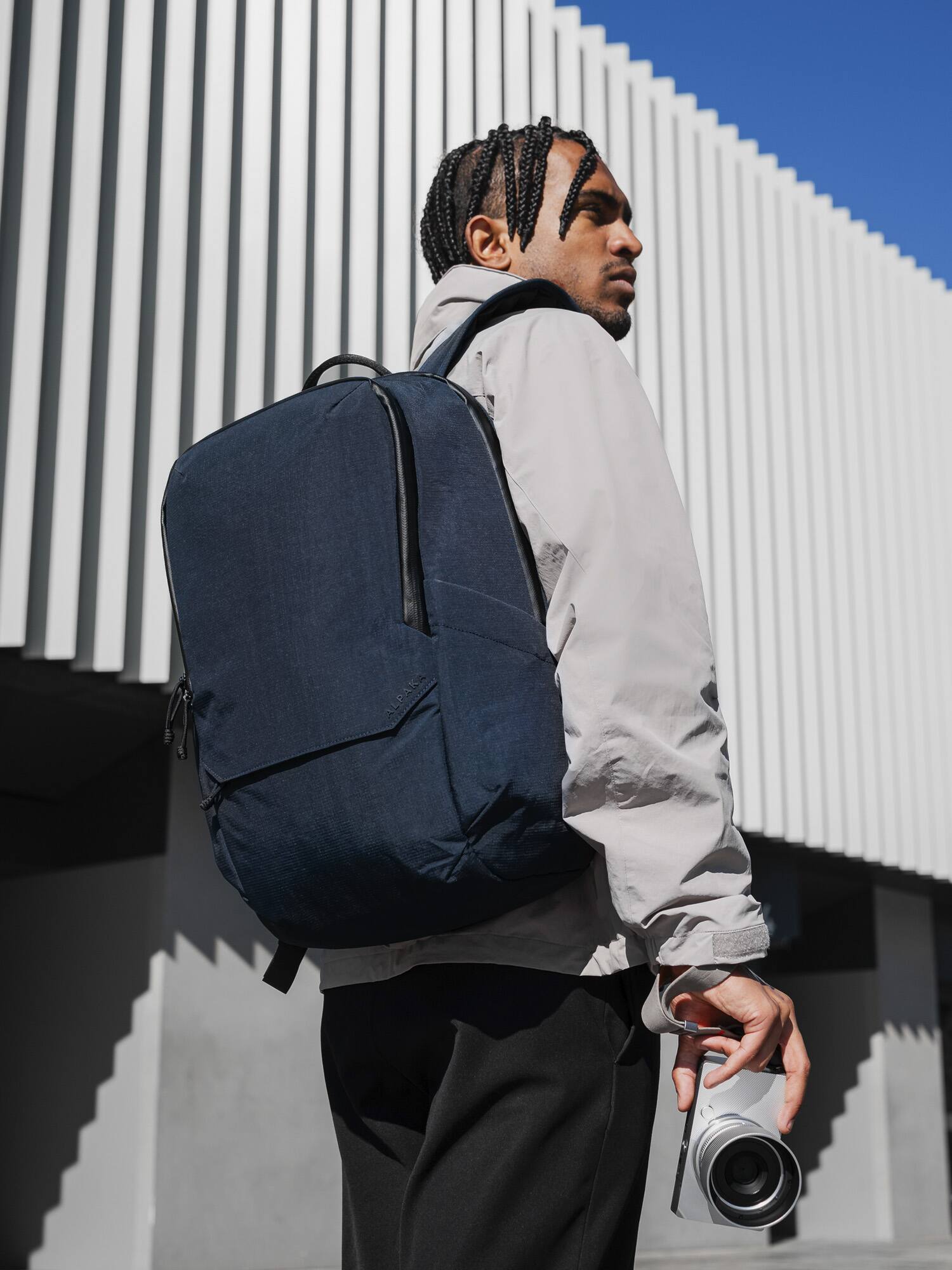 Angle. ALPAKA - Elements Backpack Pro Laptop Backpack Fits 16'' Laptop with Dual Bottle Pockets, Travel Backpack for Men - Blue Axoflux 400D Ripstop Nylon.