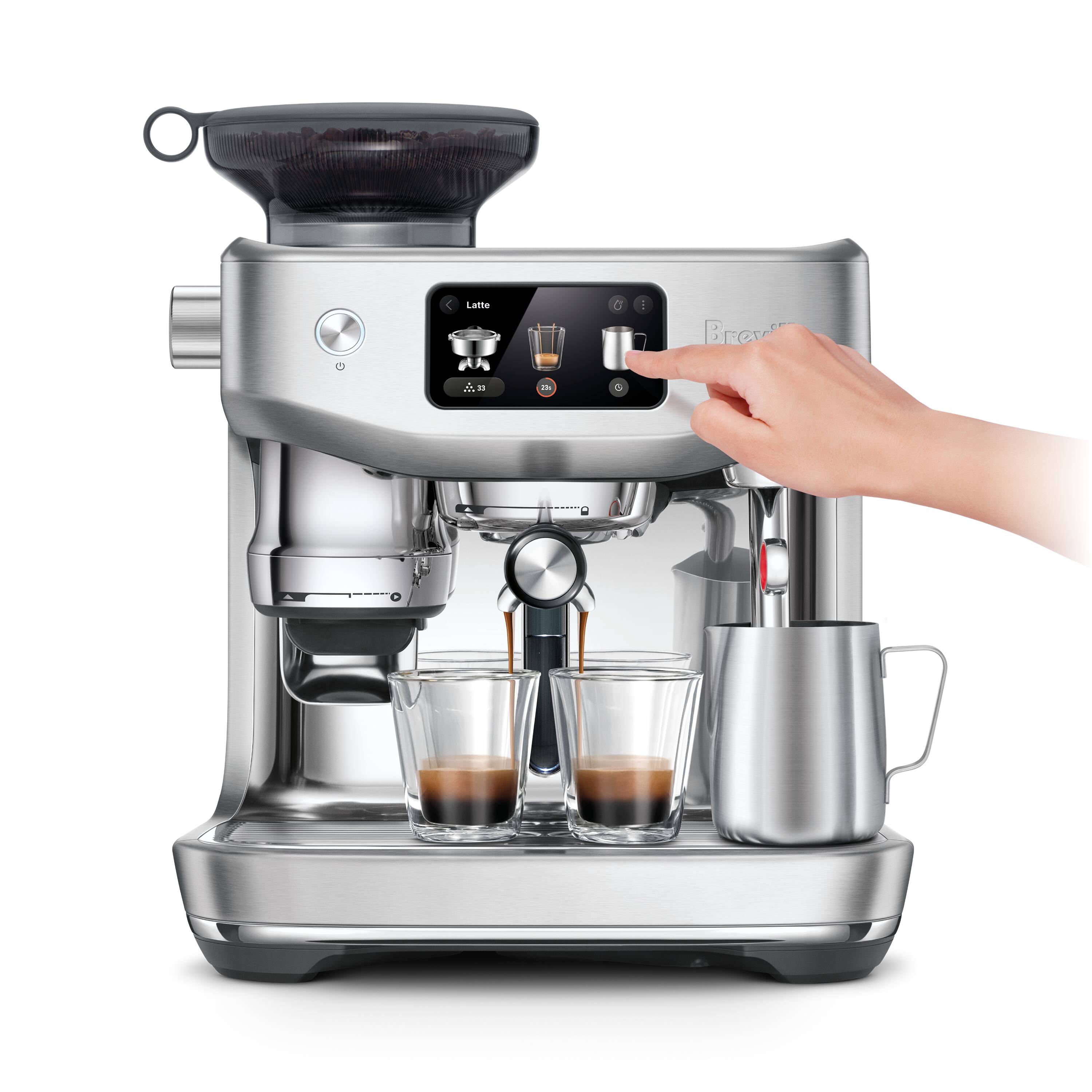 The image shows a person using a coffee maker to make coffee. The coffee maker is filled with coffee beans and has a digital display. The person is pressing buttons on the coffee maker, likely to select the desired coffee strength or type. The coffee maker is equipped with a glass carafe and a cup, ready to serve the freshly brewed coffee.