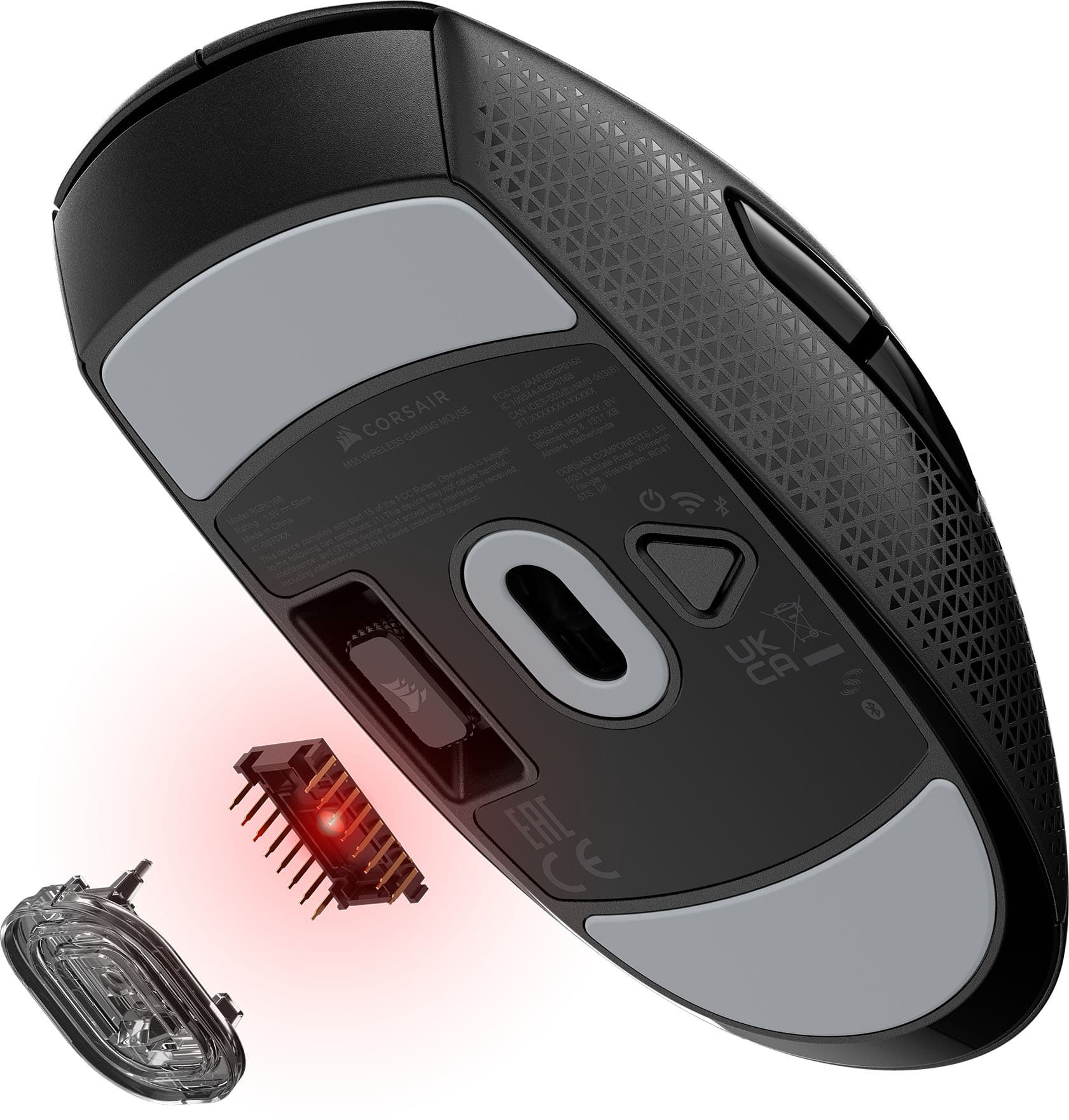 The image features a Corsair Gaming Mouse with a red light on the bottom. The mouse is designed with a black and gray color scheme, and it has a USB connection. The mouse is shown in close-up view, with its components clearly visible. The image also includes a memory card, which is a separate component of the mouse.