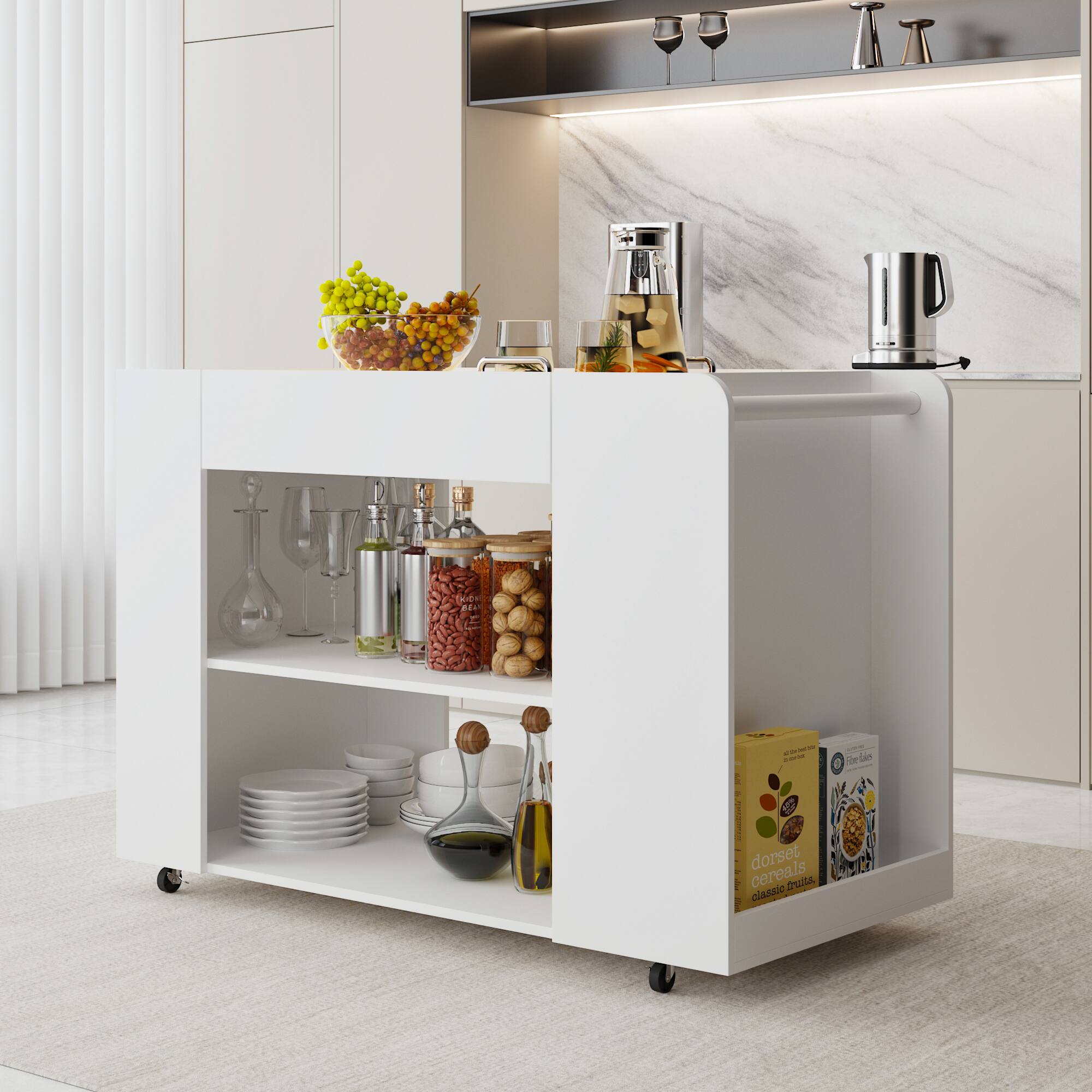 The image features a kitchen counter with a variety of items on it. There are several bottles, including a bottle of olive oil, and a bowl of fruit. Additionally, there are multiple wine glasses and cups scattered across the counter. A few books can also be seen on the counter, possibly cookbooks or other reading materials. The counter is white, and the items are arranged neatly, creating an organized and inviting atmosphere in the kitchen.
