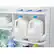 The text on the image reads: "U EXPIRE 09/2015 plain 3/4 gallon W A ST N A." This text is likely related to the expiration date and contents of the milk in the refrigerator.