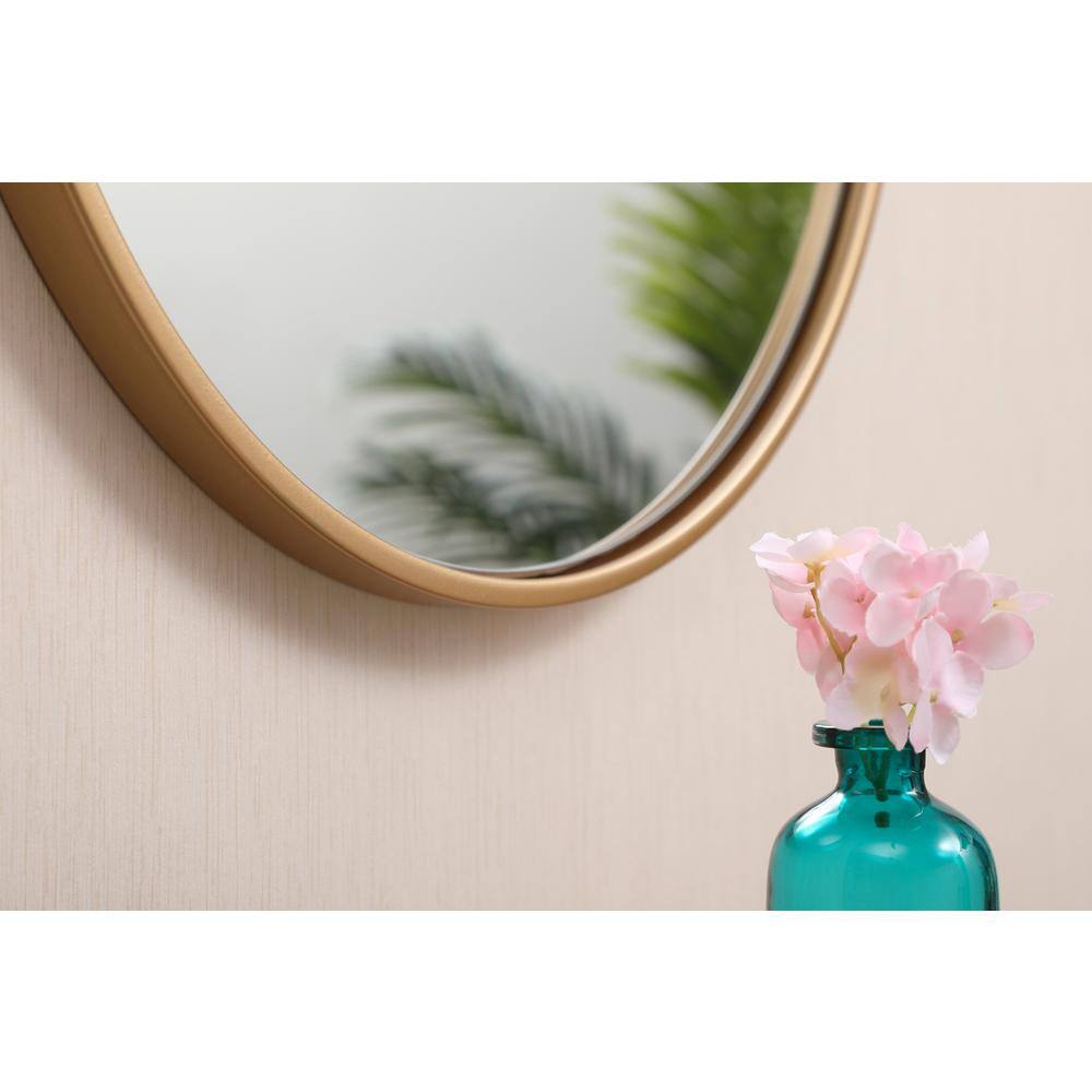 Left. Elegant Decor - Metal frame round mirror with decorative hook 18 inch in Brass - Brass.