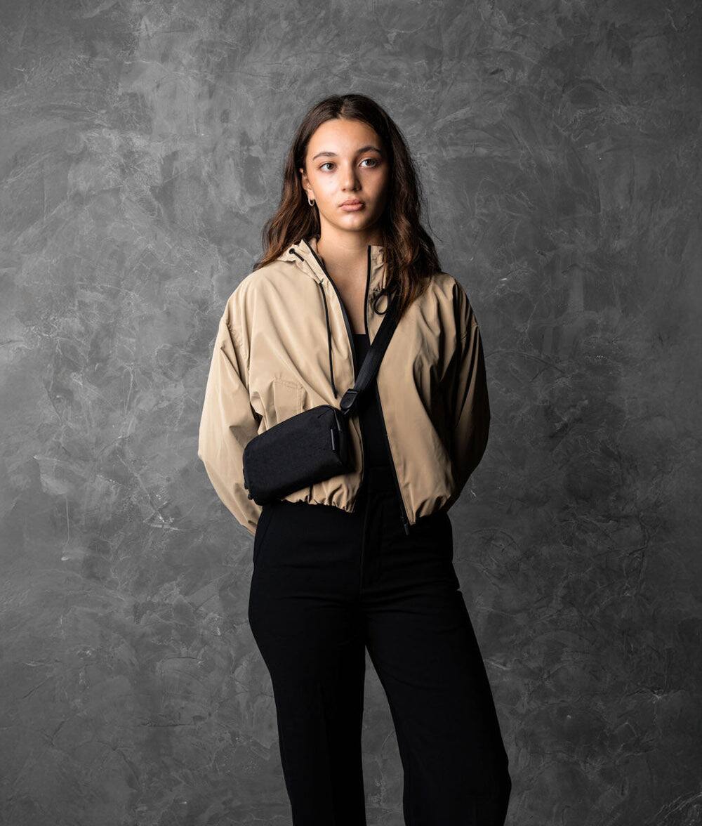 Angle. ALPAKA - Flight Pouch Pro 0.7L Men's Carry-All & Organizer Clutches;Crossbody Bag for Men with RFID Blocking, Passport Holder - Black | Axoflux 400D Ripstop Nylon.