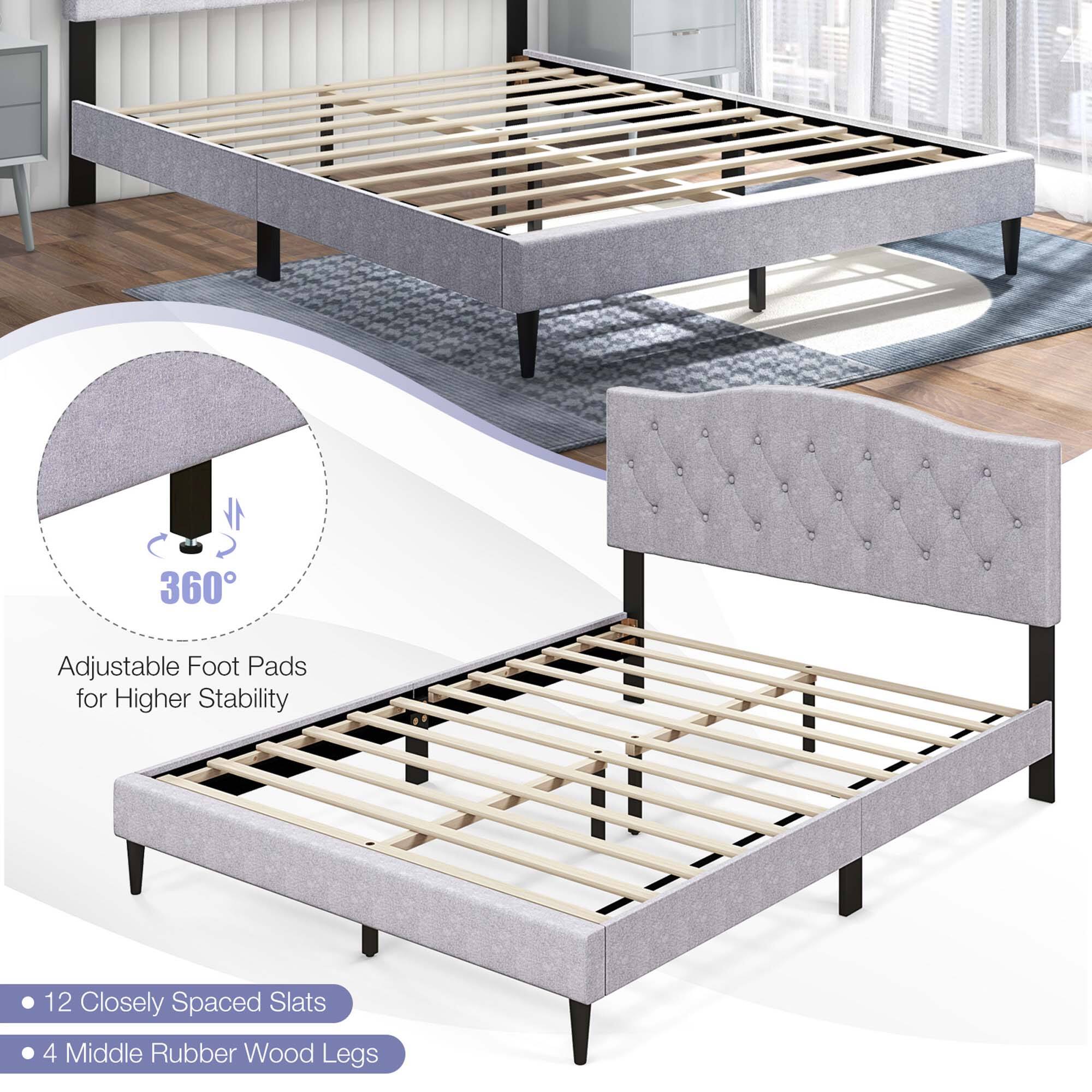 The image features a bed with a wooden frame and a grey mattress. The bed is advertised as having 360 adjustable foot pads for higher stability, 12 closely spaced slats, and 4 middle rubber wood legs. The bed is displayed in a living room setting, with a chair and a couch nearby.