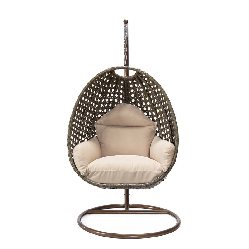 Left. LeisureMod - LeisureMod Beige Wicker Hanging Egg Chair with Iron Stand & Cushion - All-Weather Single Outdoor Patio Swing - Beige.