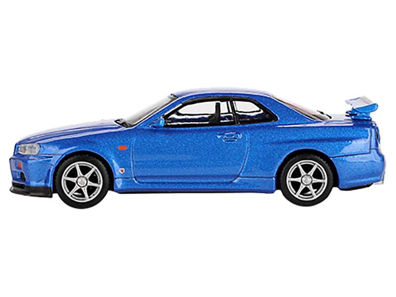 Angle. Mini GT - Nissan Skyline GT-R (R34) V-Spec RHD (Right Hand Drive) Bayside Blue Metallic Limited Edition 1/64 - Blue Metallic.