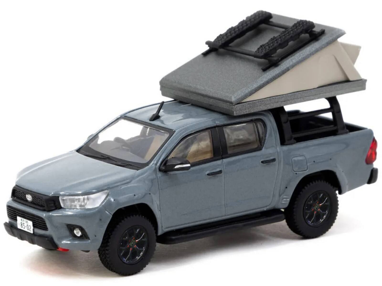 Angle. Tarmac Works - Toyota Hilux Pickup Truck RHD (Right Hand Drive) Gray with Camping Equipment Road64 Series 1/64 Diecast Model Car - Gray.