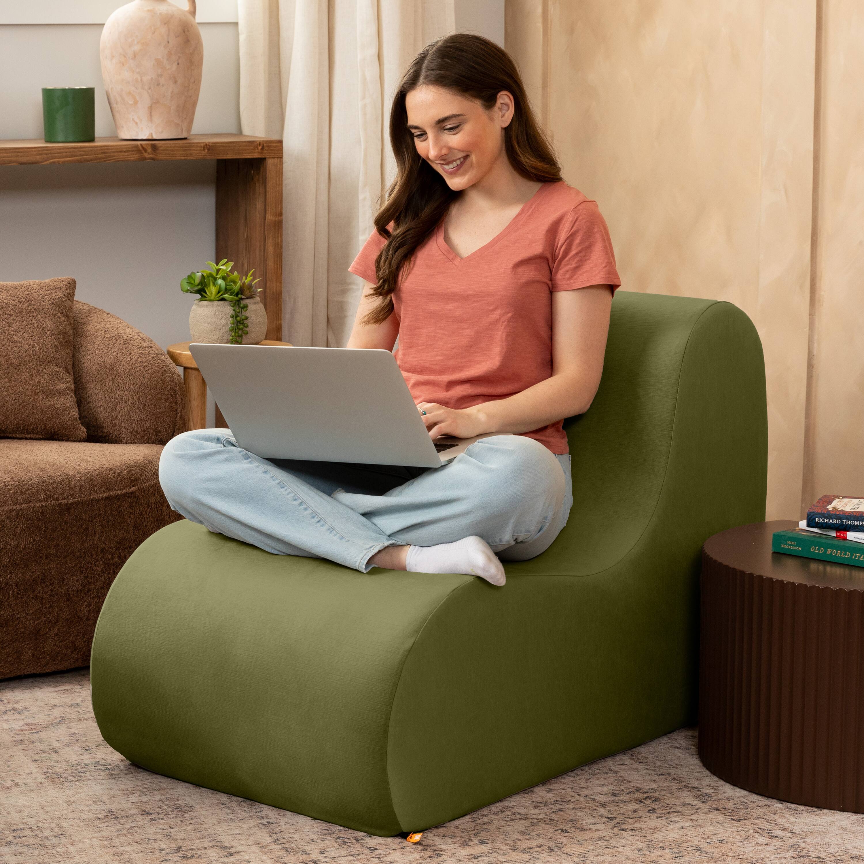The text in the image reads:

"Richard Thompson
Old World Izaak"

This appears to be the title and author of a book on the table next to the woman.