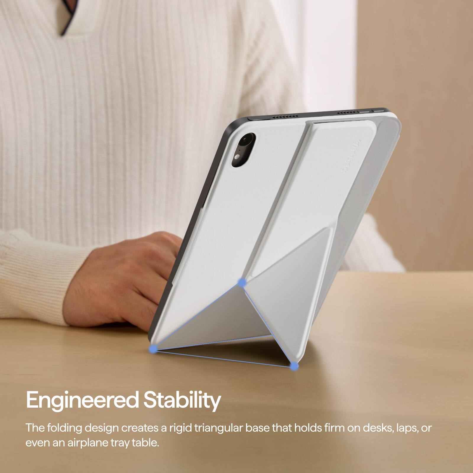 Engineered Stability  
The folding design creates a rigid triangular base that holds firm on desks, laps, or even an airplane tray table.
