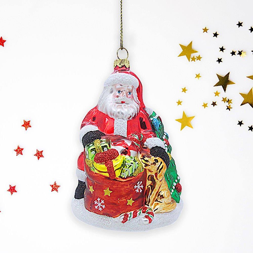Left. OrnamentallyYou - Santa with Dog and Giant Gift Bag Glass Christmas Ornament - Multi-colored.