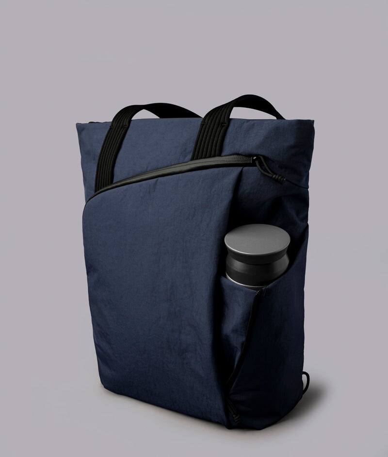 Alt View 5. ALPAKA - Flow Totepack Laptop Backpack for Men, 16" Laptop Compartment + 11" Tablet Sleeve, Tote/Backpack, Bottle Pocket - Moonlight Blue Axoflux 400D Washed Nylon.