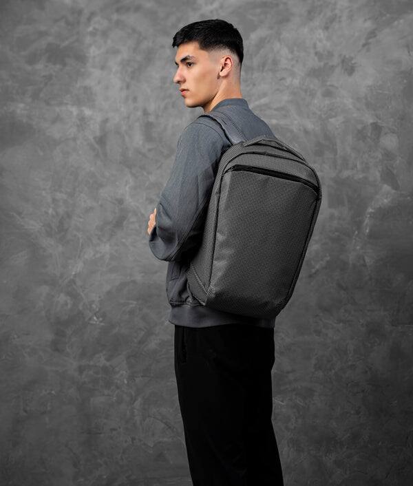 Angle. ALPAKA - Lightweight 22L Laptop Backpack for 16-inch Laptop, Momentum Backpack for Work, Travel & Commuting, Weather-Resistant - Axodyne hybrid Grey.