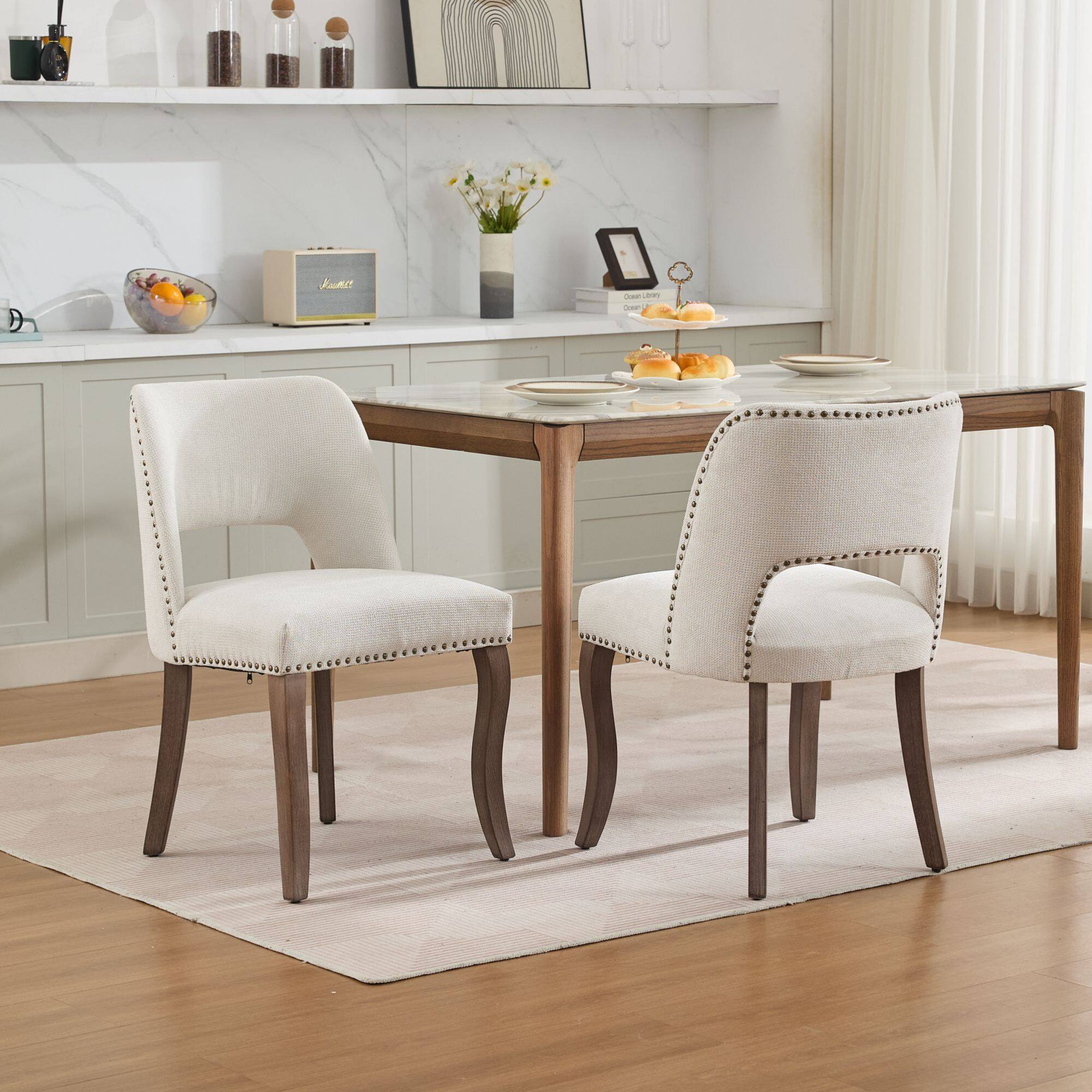 Angle. GOODSILO - Modern Fabric Upholstered Dining Chairs Set of Two with Curved Backrest and Solid Wood Legs - Beige.