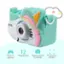 The image features a small, light blue toy camera with a pink and white design. It is a toy camera that takes photos, plays games, and records videos. The camera has a built-in 12-megapixel camera that allows users to capture high-quality images. Additionally, the camera has a 2-inch preview screen, which enables users to view their photos and videos before taking them.