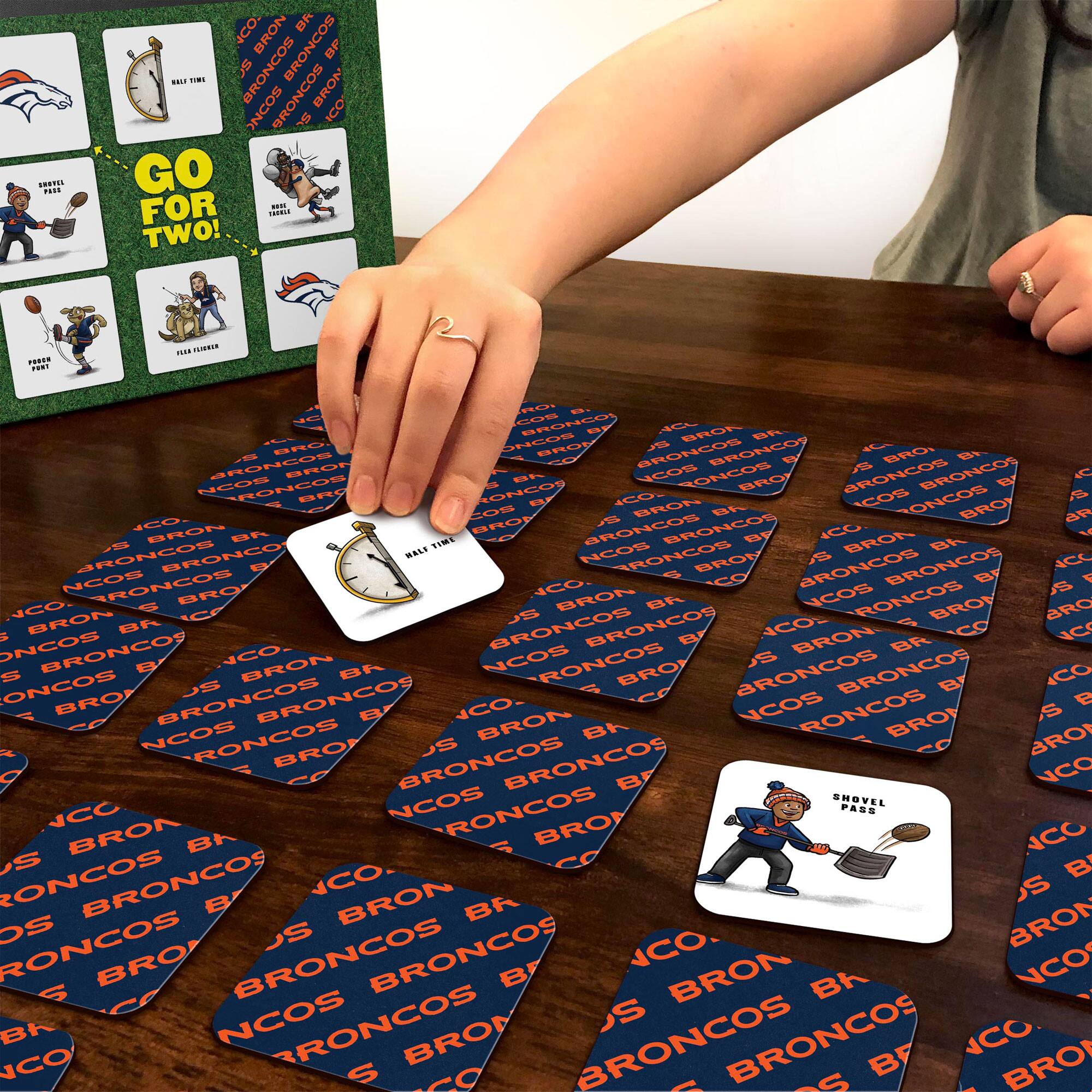 Sure, here is the corrected and grouped text from the image:

**Top Left Card:**
- GO FOR TWO!

**Top Right Card:**
- HALF TIME

**Middle Left Card:**
- SHOVEL PASS

**Middle Right Card:**
- FIELD GOAL

**Bottom Left Card:**
- PUNT RETURN

**Bottom Right Card:**
- TOUCHDOWN

**Cards on Table:**
- BRONCOS
- BRONCOS
- BRONCOS
- BRONCOS
- BRONCOS
- BRONCOS
- BRONCOS
- BRONCOS
- BRONCOS
- BRONCOS
- BRONCOS
- BRONCOS
- BRONCOS
- BRONCOS
- BRONCOS
- BRONCOS
- BRONCOS
- BRONCOS
- BRONCOS
- BRONCOS
- BRONCOS
- BRONCOS
- BRONCOS
- BRONCOS
- BRONCOS
- BRONCOS
- BRONCOS
- BRONCOS
- BRONC