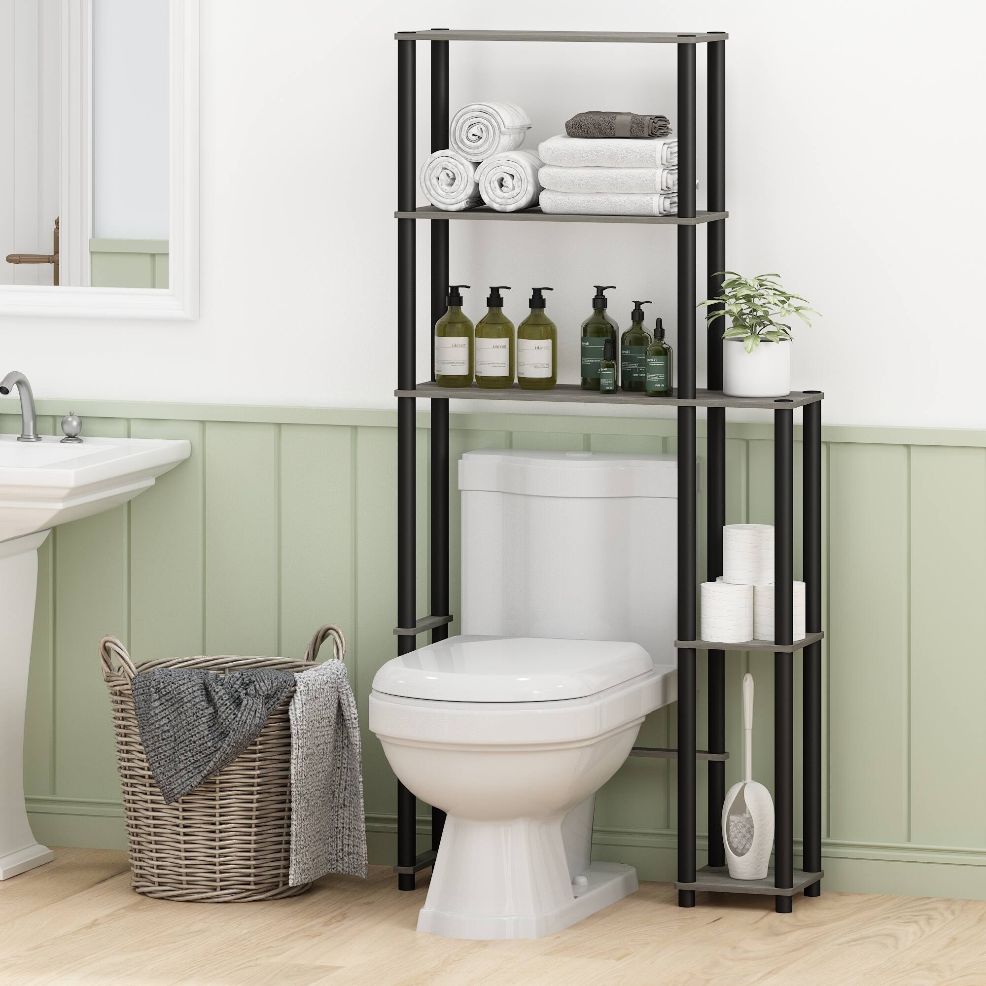 The text in the image is not clearly visible, so I cannot provide a correction. However, I can help with the description of the image:

The image shows a modern bathroom with a white toilet and a black metal shelf unit. The shelf has several items, including rolled towels, bottles of toiletries, a potted plant, toilet paper, and a cleaning brush. There is also a wicker basket with a towel on the floor next to the toilet. The walls are painted in a light green color with white trim.