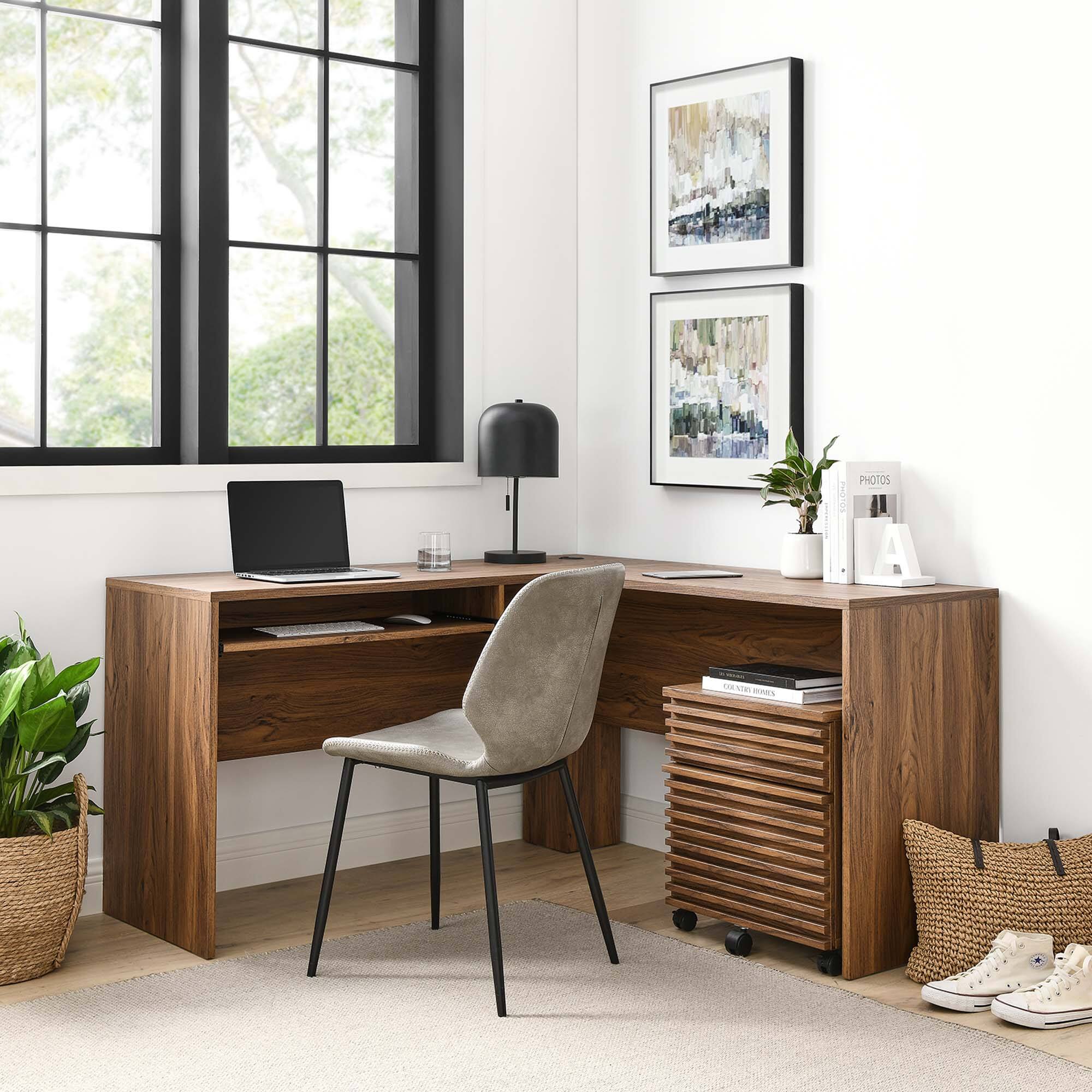 A beautiful home office setup with a wooden desk, a comfortable chair, and a large window. The desk is equipped with a laptop, a lamp, and a few decorative items. There are two framed abstract paintings on the wall, and a small plant adds a touch of greenery. A storage cart with books and a pair of sneakers is placed beside the desk. The text "PHOTOS" is visible on a small organizer.