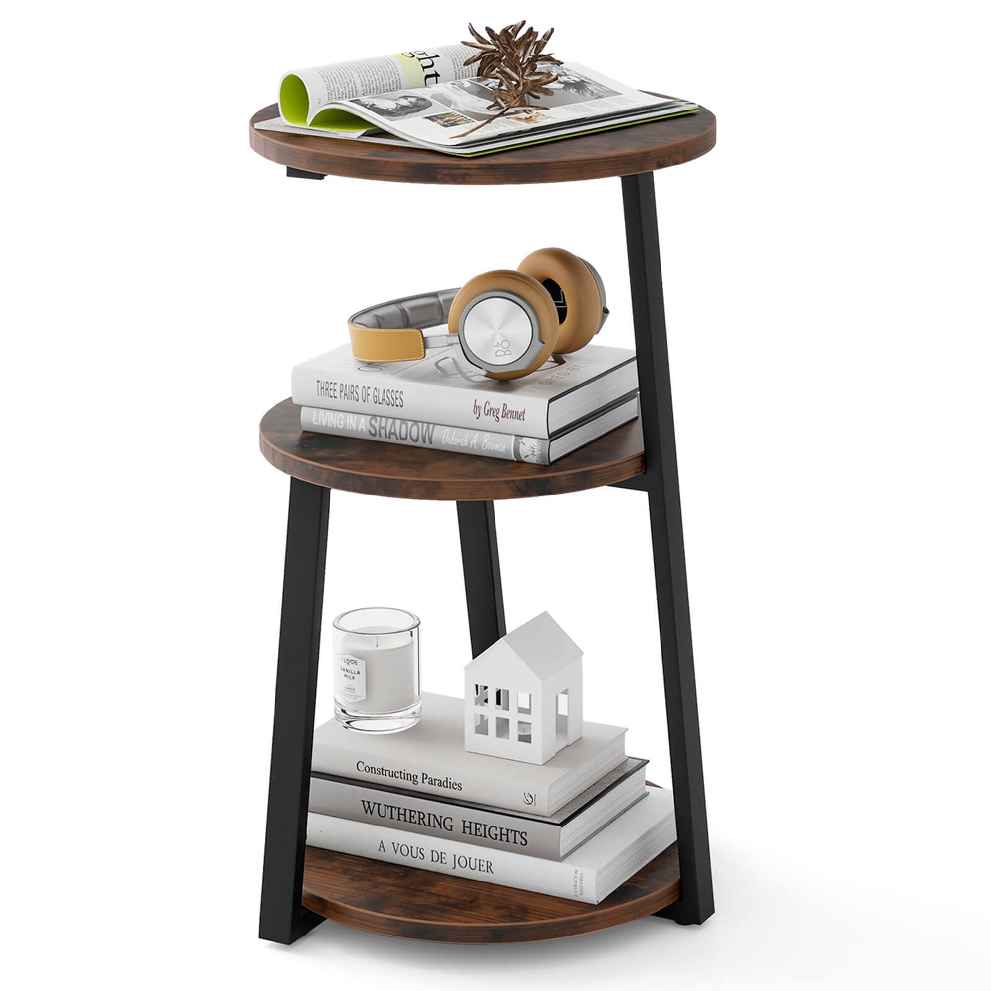 The image features a wooden tray stand with a variety of items on it. There are three pairs of glasses, a book titled "Wuthering Heights," and a candle. The stand is placed on a table, and the items are arranged neatly on the shelf. The combination of these items creates a cozy and organized atmosphere.