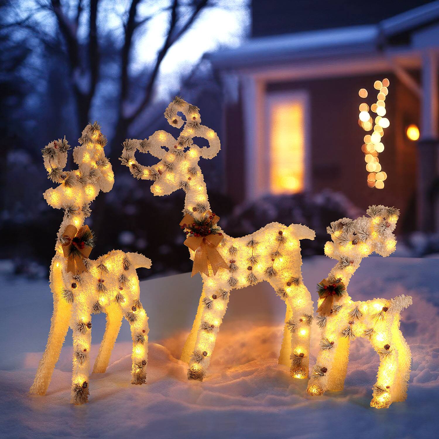 Angle. Oumilen - Pre‑Lit Flocked Reindeer 3‑Piece Set – L/M/S Christmas Yard Sculptures with Bow & Pine Cone for Outdoor Lawn.