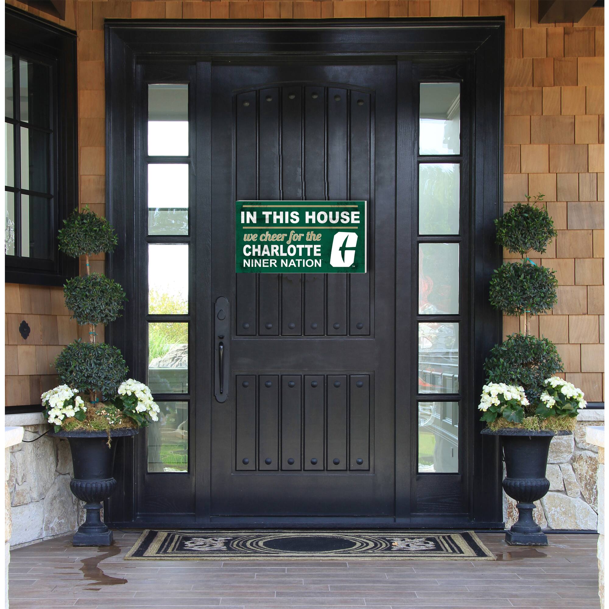 IN THIS HOUSE  
we cheer for the  
CHARLOTTE  
NINER NATION