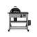 The image features a large black grill on a metal cart. The grill has a black lid and is sitting on top of the cart. The cart is placed on wheels, making it easy to move around. The grill is likely used for cooking outdoors, providing a convenient and portable option for outdoor cooking needs.