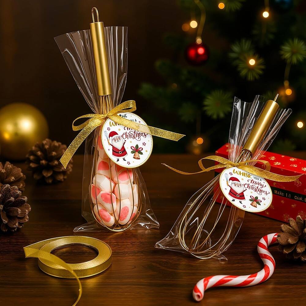 Sure, here is the corrected and grouped text from the image:

---

**Left Gift:**
- "WHISK YOU A Merry Christmas"
- "MAKE: 1/4 CROWD."

**Right Gift:**
- "WHISK YOU A Merry Christmas"
- "MAKE: 1/4 CROWD."

---

The text is part of the labels on the gift bags.