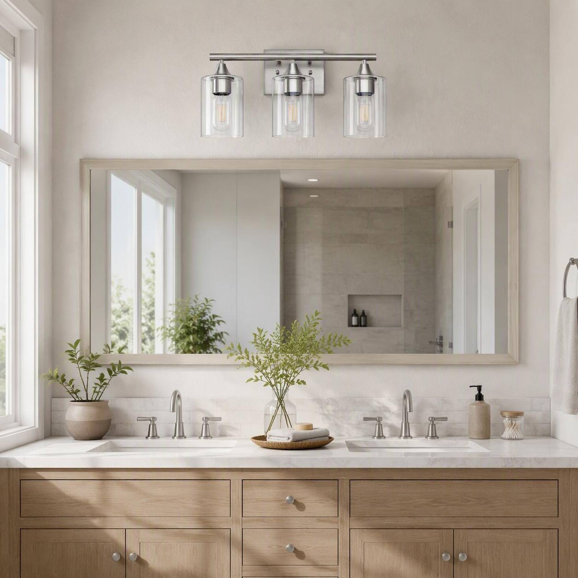 Left. RYHNUYNE - 3-Light Brushed Nickel Vanity Light with Clear Glass Shades, Moisture-Resistant Iron Frame, Reversible Wall Sconce.