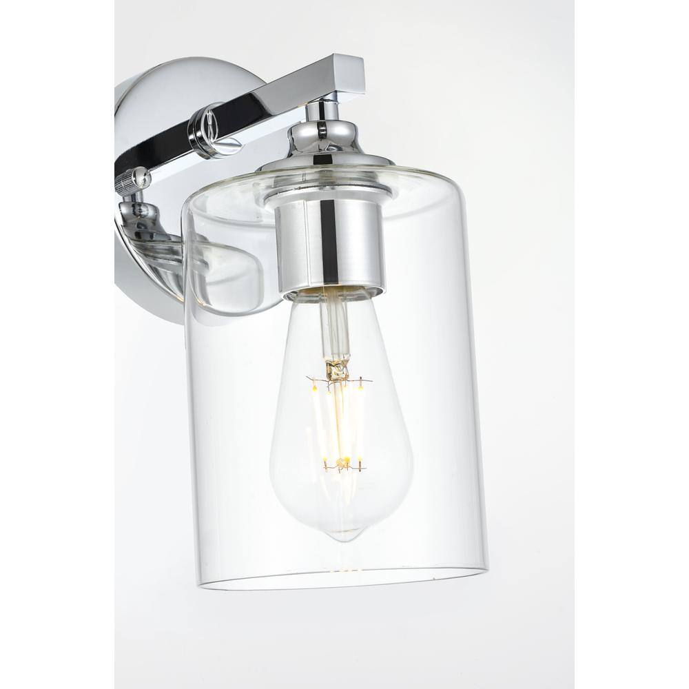 Left. Living District - Mayson 1 light Chrome and Clear Bath Sconce - Chrome And Clear.