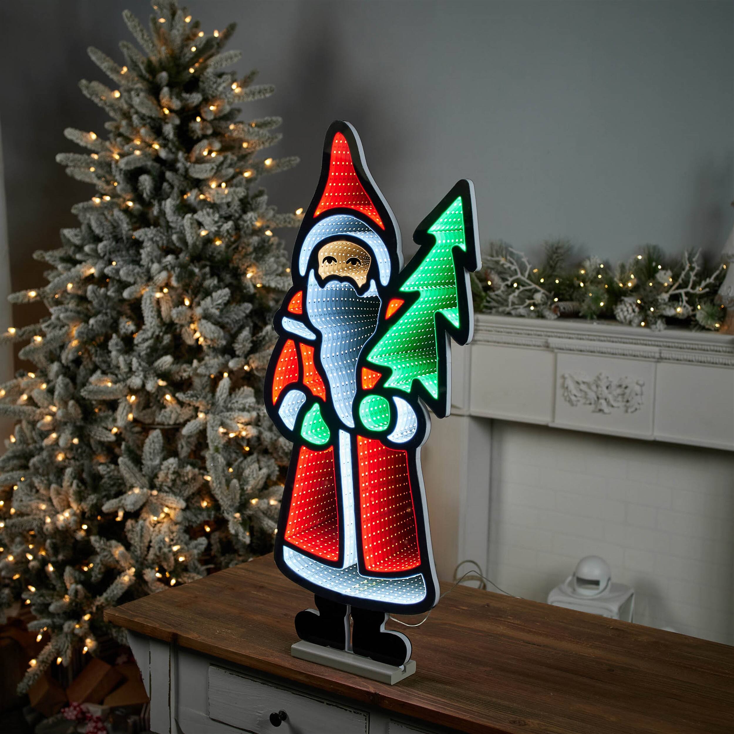 Left. BreeBe - Santa with Pine Tree Ekkolight 33"H - Red, White, Green.