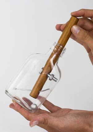 Front. Professor Puzzle - Creative Minds Churchill Whiskey Bottle Puzzle Game.