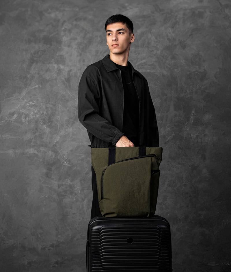Left. ALPAKA - Flow Totepack Laptop Backpack for Men, 16" Laptop Compartment + 11" Tablet Sleeve, Tote/Backpack, Bottle Pocket - Green Axoflux 400D Washed Nylon.