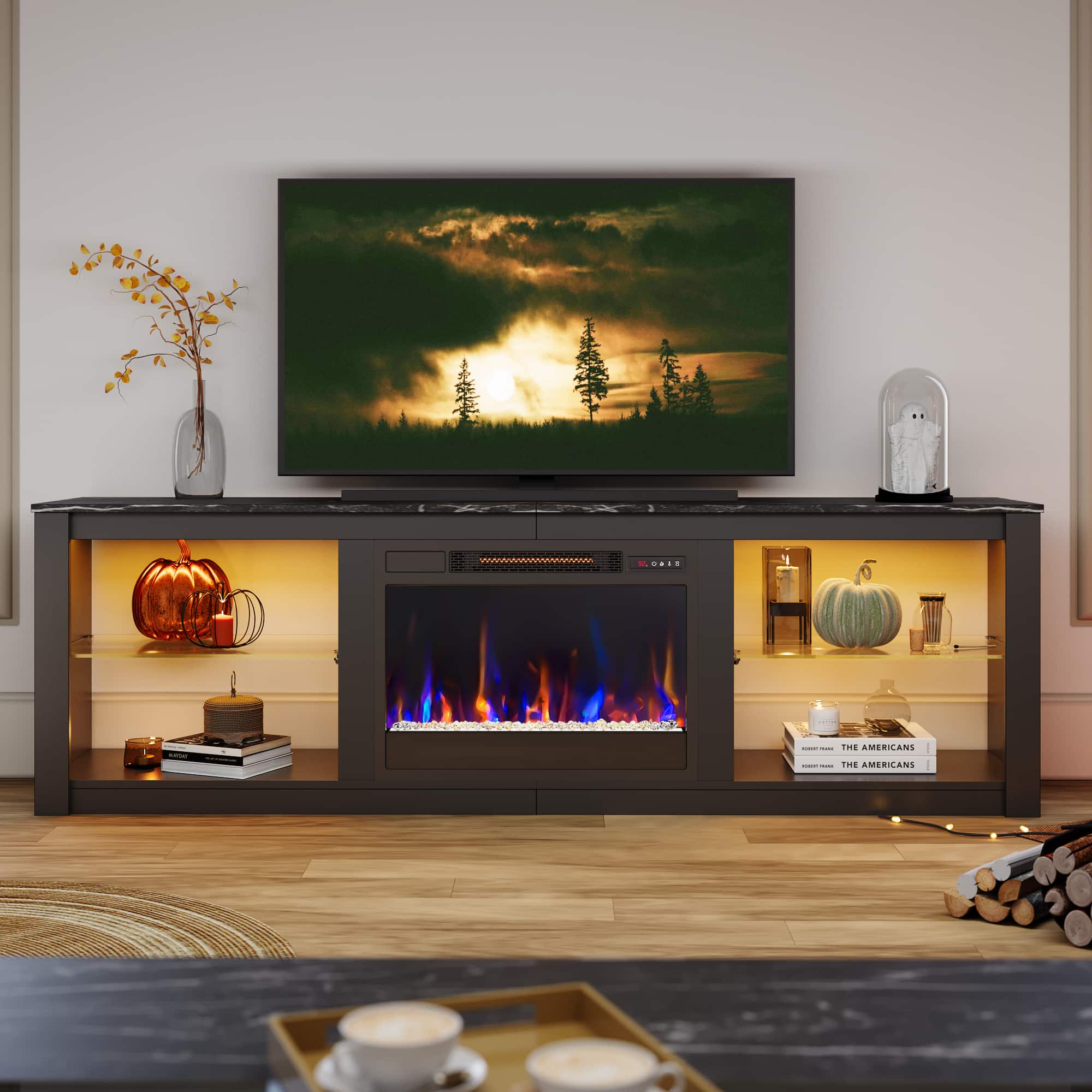 The American TV is turned on and displaying a fireplace scene.