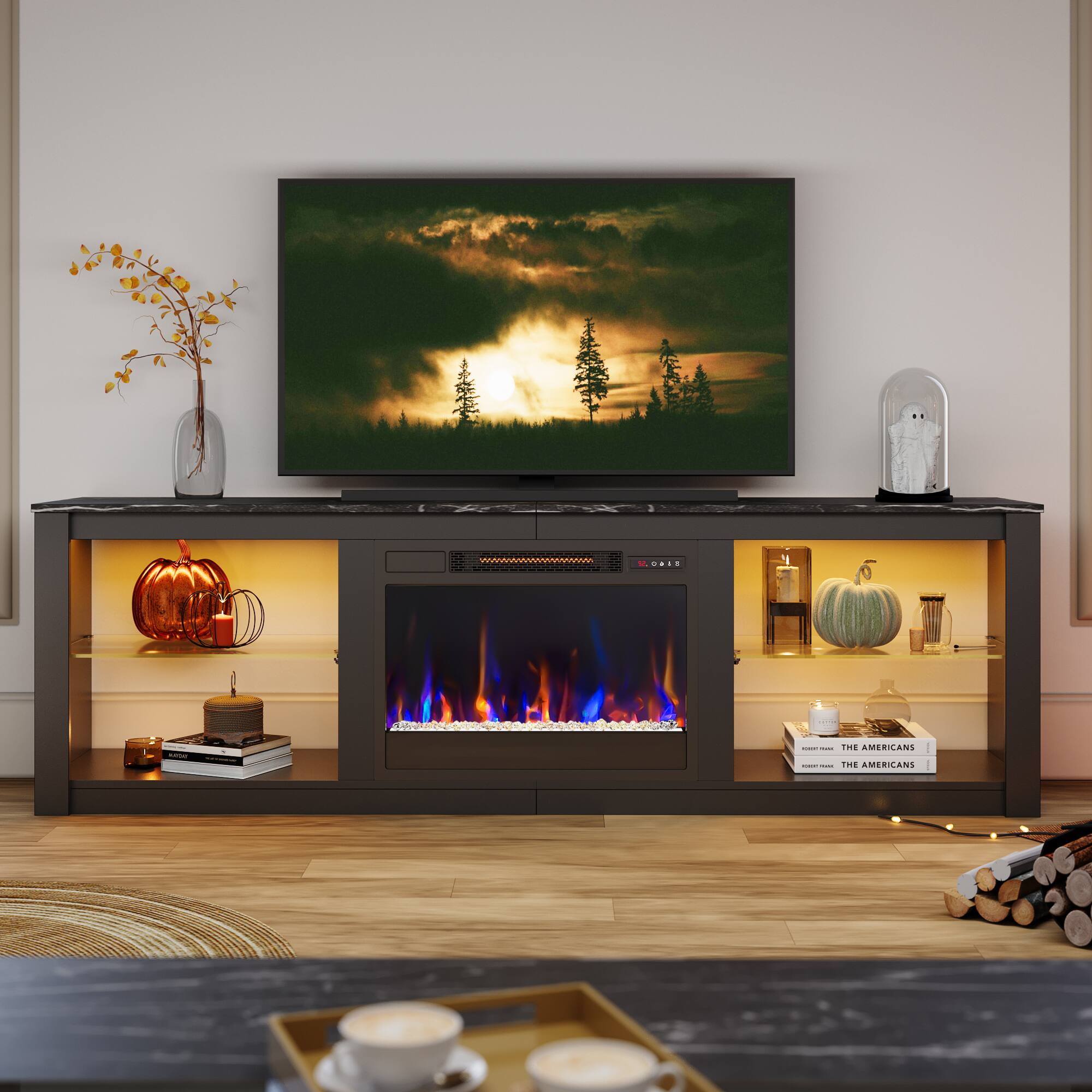 The American TV is turned on and displaying a fireplace scene.