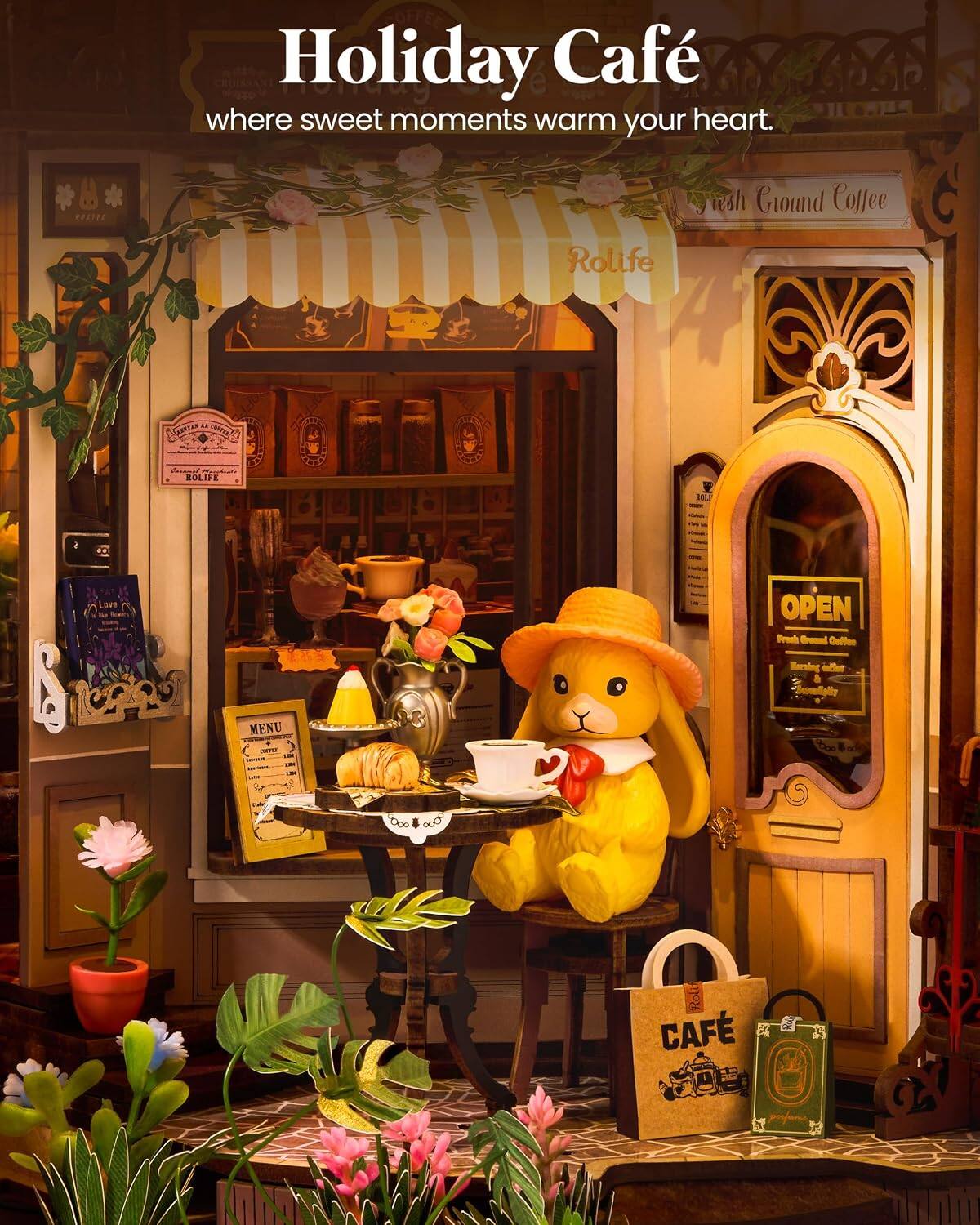 Holiday Café where sweet moments warm your heart.  
CRATER Sweth Ground Coffee Rolife  
Tamter TTE SE ROLIFE F BOO LOve OPEN Seeal Gread Colfee Mering aufer & Saomfially MENU tpo toe Roli CAF  
KINN