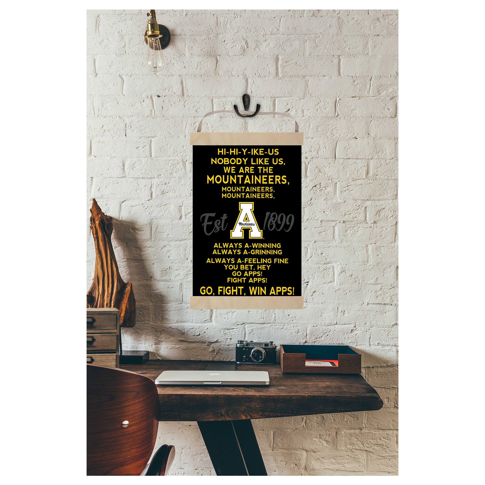 HI-HI-Y-IKE-US  
NOBODY LIKE US.  
WE ARE THE MOUNTAINEERS, MOUNTAINEERS.  
MOUNTAINEERS, MOUNTAINEERS.  

Est A - 1899  

ALWAYS A-WINNING  
ALWAYS A-GRINNING  
ALWAYS A-FEELING FINE  
YOU BET. HEY  
GO APPS!  
FIGHT APPS!  
GO, FIGHT, WIN APPS!  

2 2