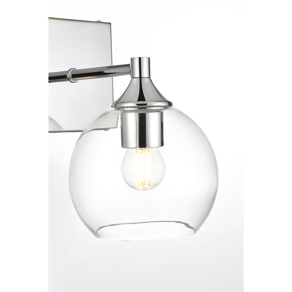 Left. Living District - Foster 1 light Chrome and Clear Bath Sconce - Chrome And Clear.