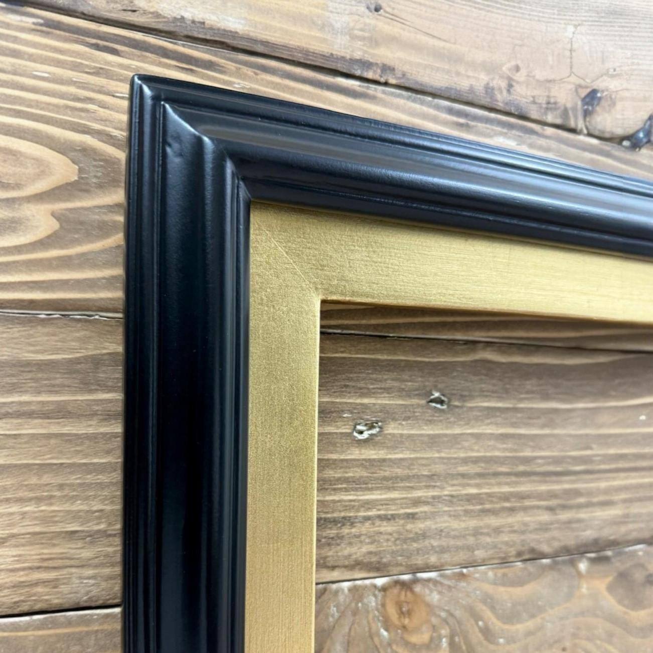 Alt View 1. LAREDO FRAME FACTORY - 55 inch Handmade Tv frame for Samsung The Frame tv and Frame Pro Model - SATIN BLACK WITH GOLD LEAF.