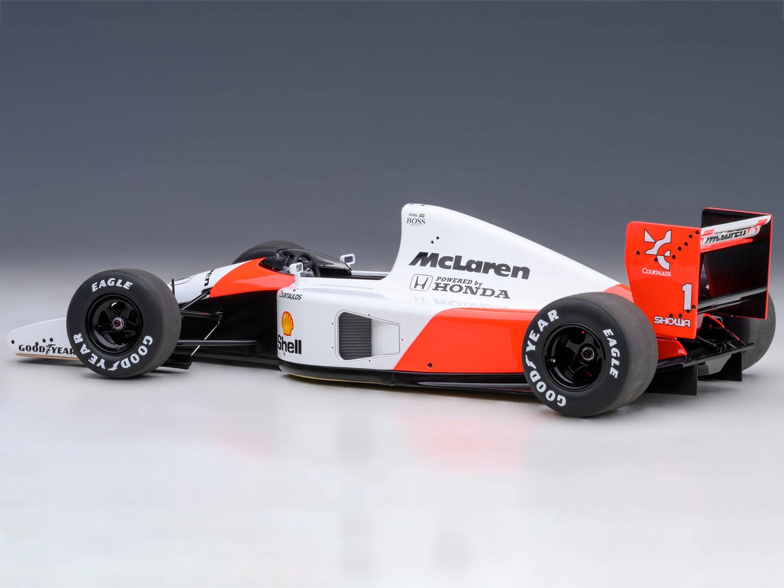 EAGLE GOOD YEAR COODSYEAR

en

COURTAULDS Shell

- BOSS McLaren POWERED by HONDA

HITOTA YEAR LOODY

ITTLIAITED COURTAULDS 1 SHOWA EAGLE