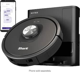 The image features a black robotic vacuum cleaner, which is a Shark Mattrx. The vacuum is sitting next to a cell phone, which is sold separately. The robotic vacuum is designed to clean and maintain the cleanliness of the floor.