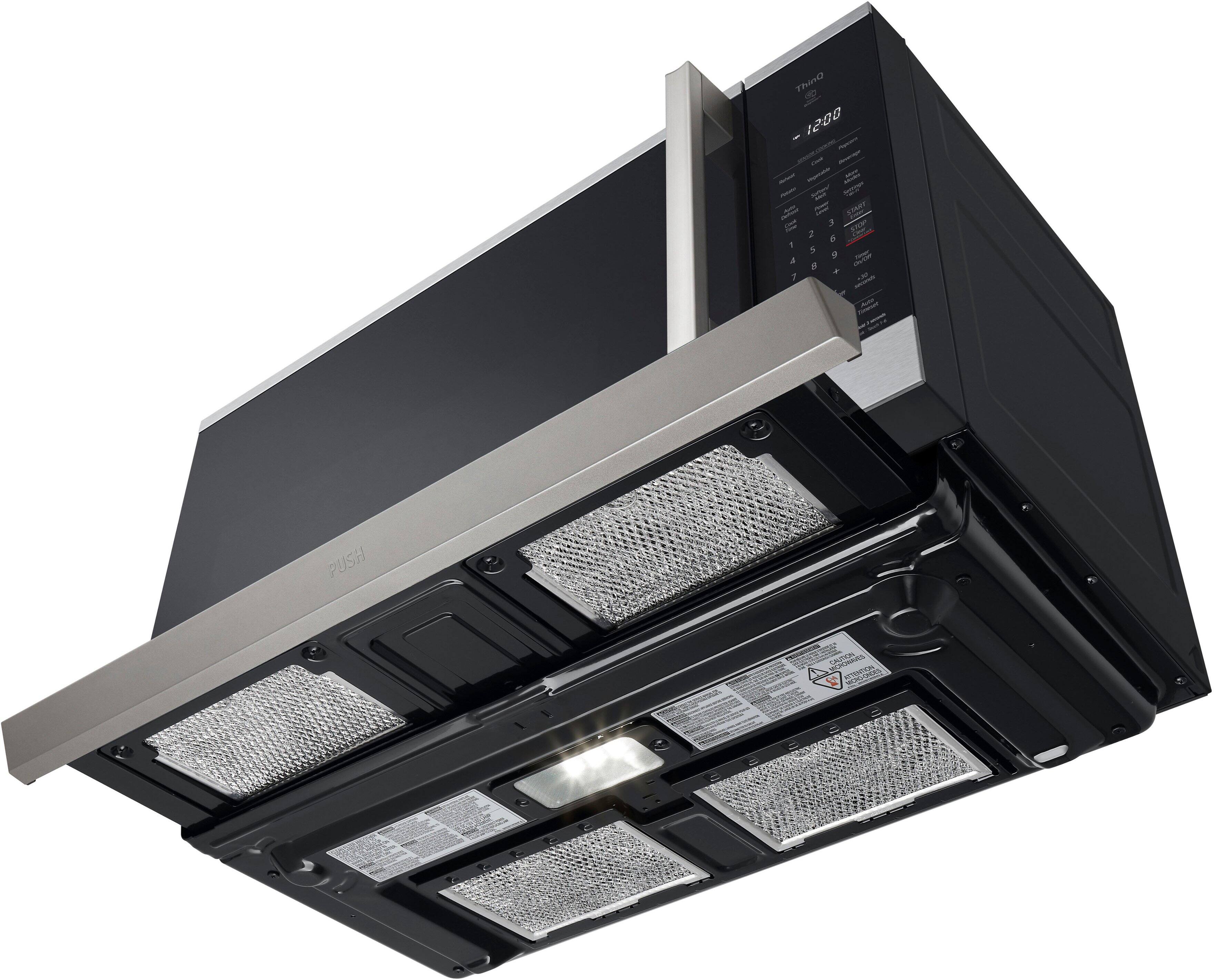 The text on the image reads "h - 1200 1 . i IRY 3 STM 2 5 a - PUSH to see VITRE." This text is likely a description or instructions for the microwave oven.