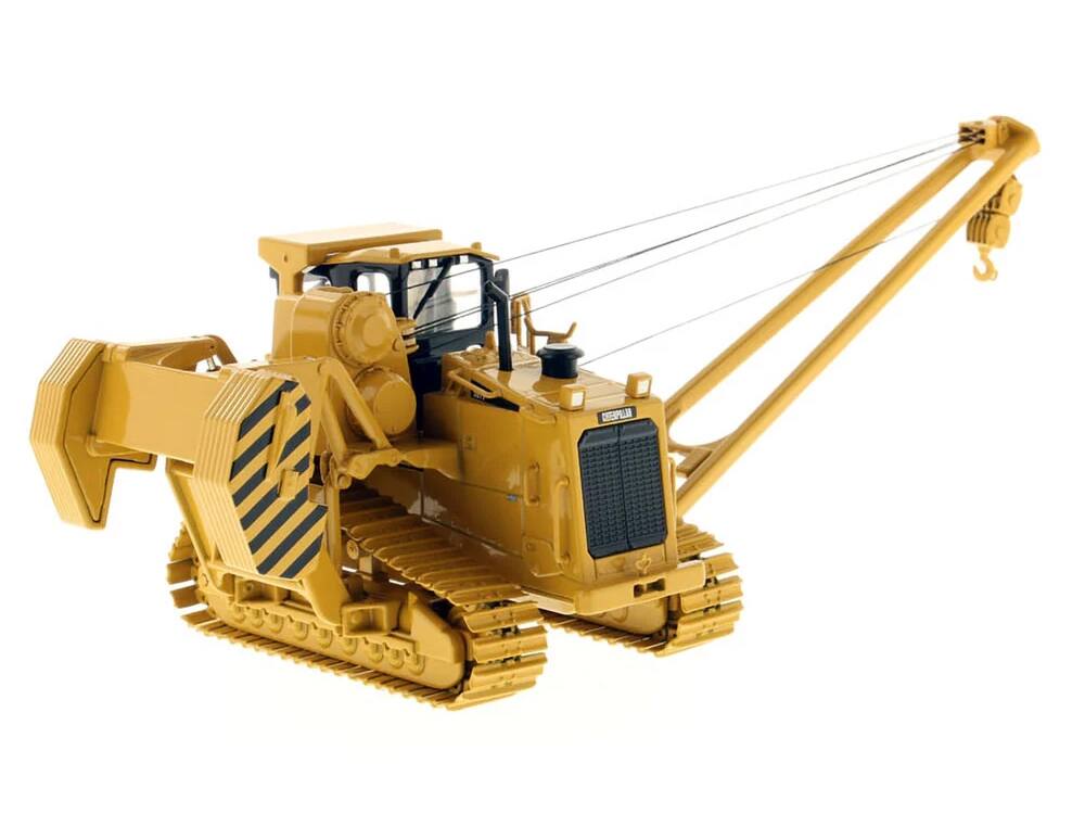 Angle. Diecast Masters - CAT Caterpillar 587T Pipelayer with Operator "Core Classics" Series 1/50 Diecast Model by Diecast Masters - Yellow .