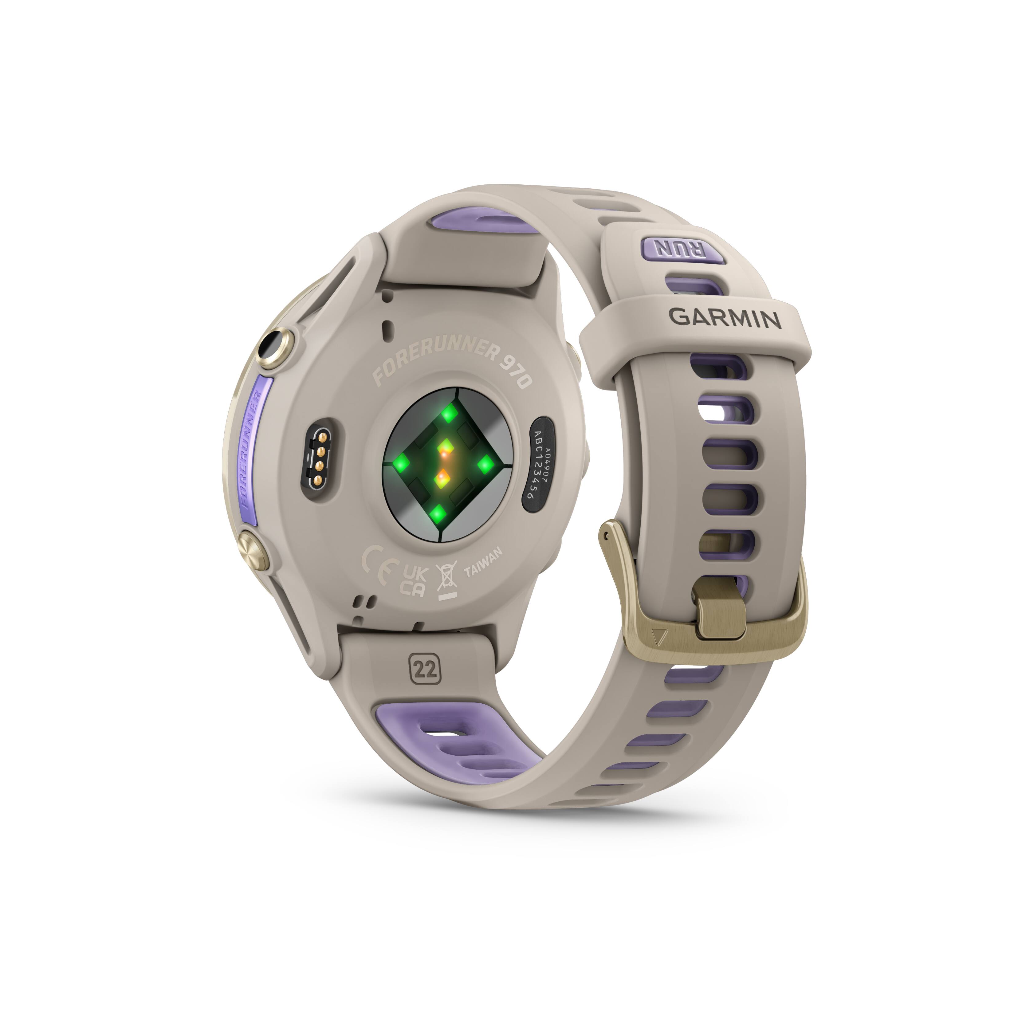 The image shows a Garmin watch with a purple and tan band. The watch is designed for runners and has a green light on the face. The watch is made in Taiwan and is a Forerunner 970 model.