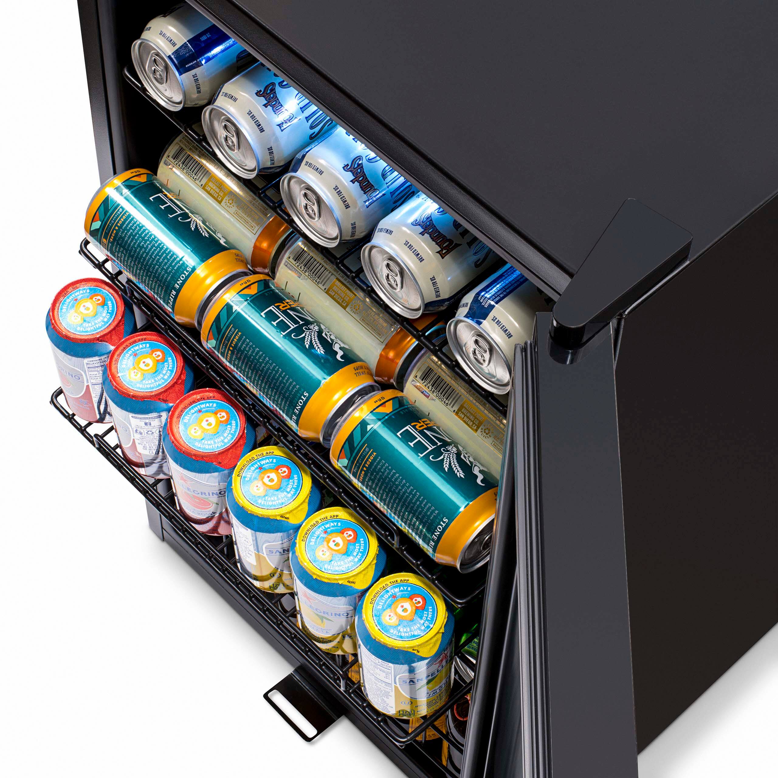 The image displays a beer cooler with a variety of beer cans and bottles. The beer cans are arranged in rows, with some placed in the middle and others towards the top of the cooler. The bottles are also organized in rows, with some located in the middle and others towards the top of the cooler. The cooler is filled with a diverse selection of beer options, catering to different tastes and preferences.