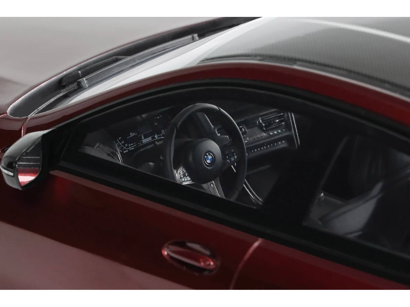 Angle. GT Spirit - 2023 BMW M850I xDrive M Performance Aventurine Red with Carbon Top 1/18 Model Car by GT Spirit - Red with Carbon.