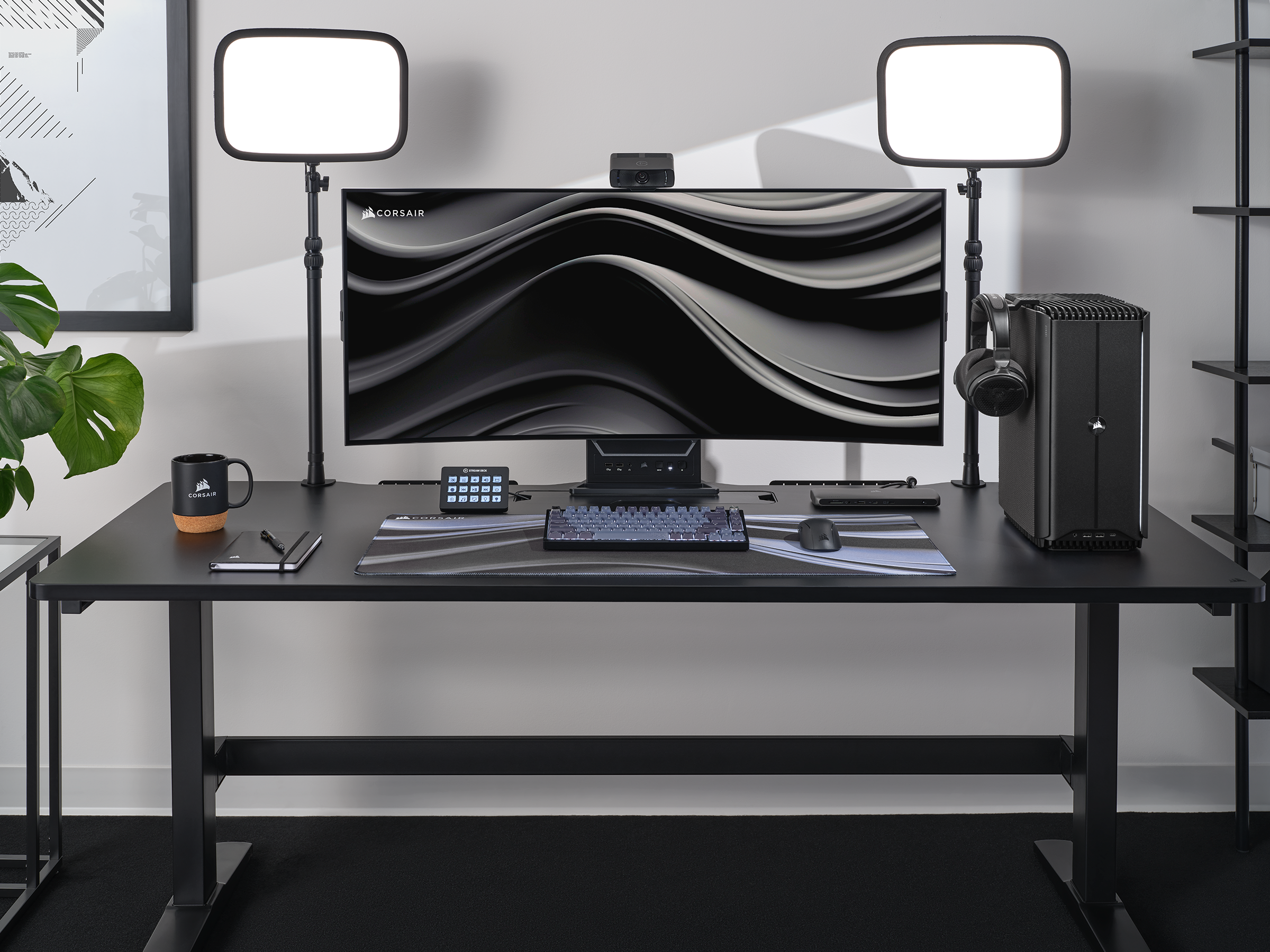 Corsair is a brand of computer peripherals and components, such as keyboards, mice, and memory. In the image, there is a Corsair keyboard on the desk.