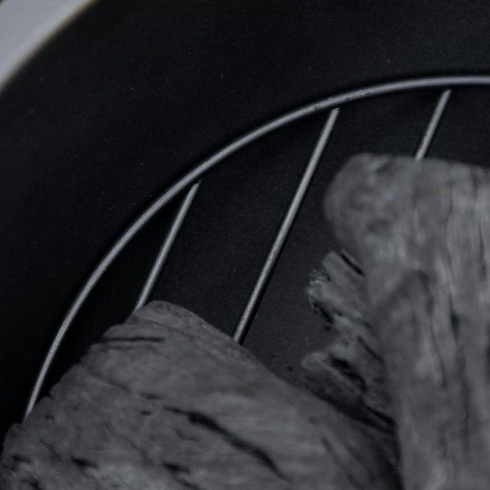 Angle. Resenkos - 18 Inch Outdoor Fire Pit, Metal Wood Burning Fireplace with Spark Cover, Poker for Patio, Picnic, Backyard, Dark Brown.