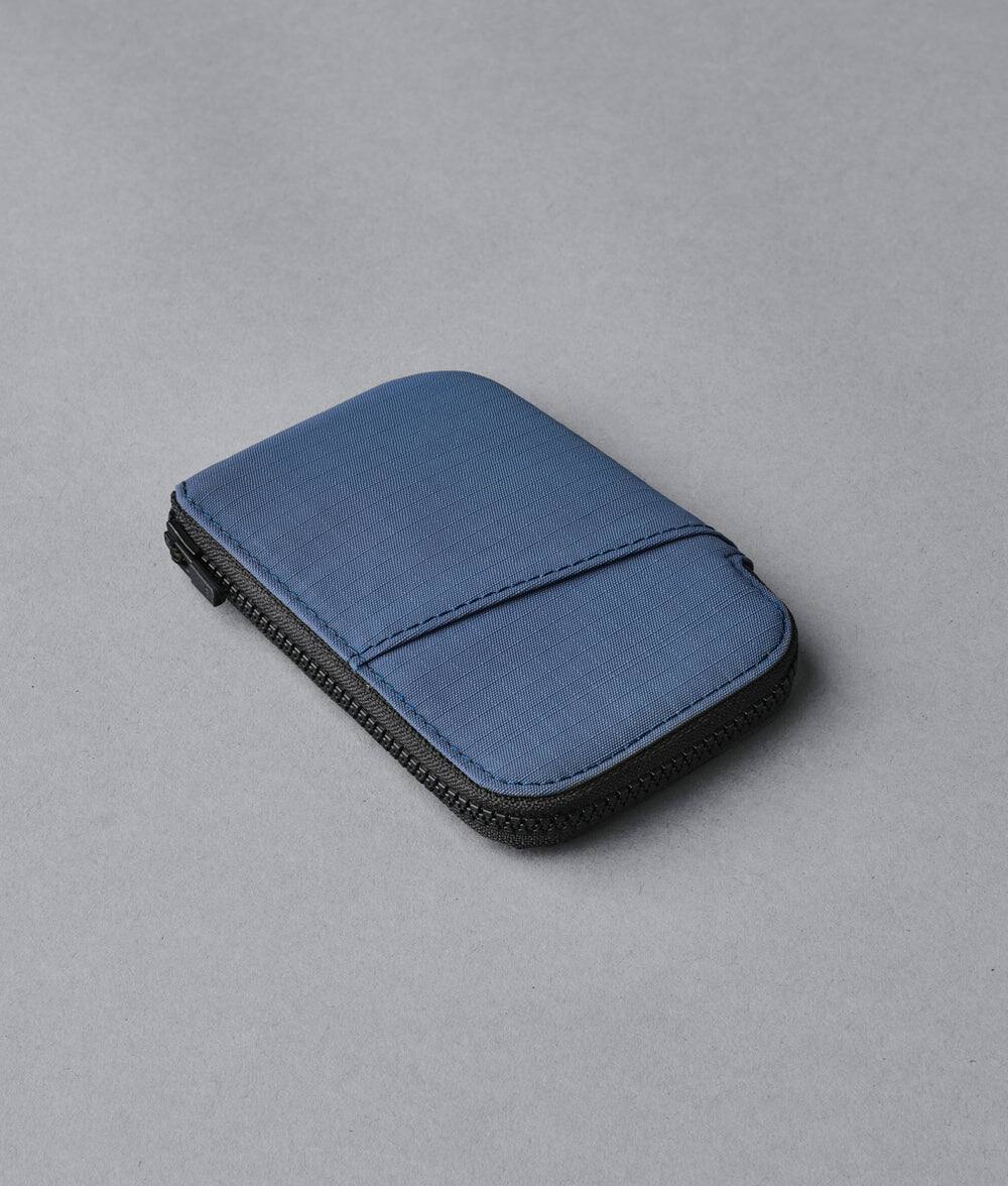 Angle. ALPAKA - RFID Zip Card Pouch with YKK Silent Zippers, Holds 12–20+ Cards, Coin & Cash Storage, Front Transit Slot, HUB Compatible - Blue Axoflux 210D.