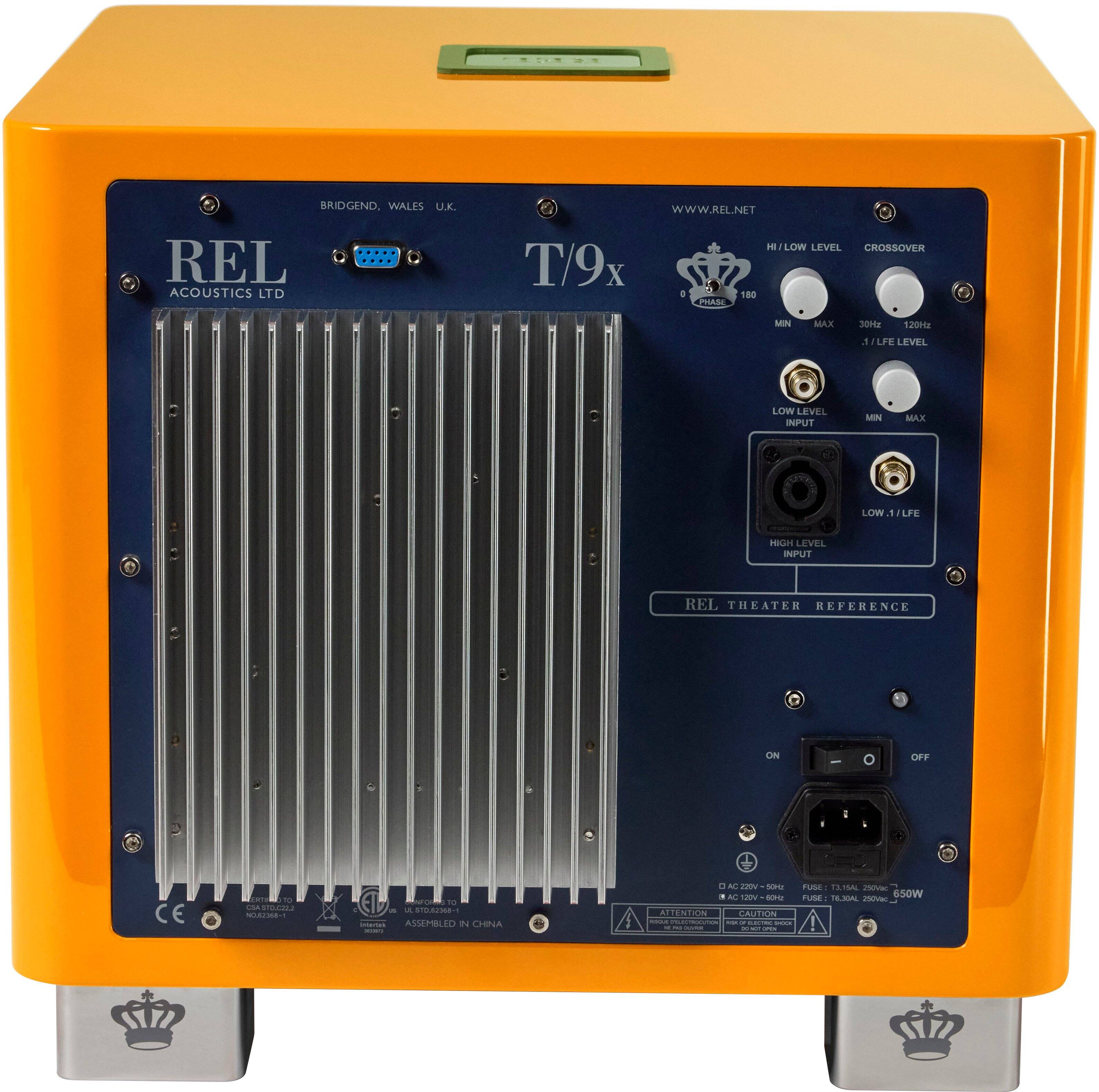 The text on the image reads: "BRIDGEND, WALES U.X. REL ACOUSTICS LTD WWW.REL.NET LOW LEVEL CROSSOVER T/9x o 180 PA MIN MAX 30 120H . LF LEVEL LOW LEVEL INPUT MAN MAX LOW, LFE HIGH LEVEL INPUT REL THEATER REFERENCE ON I OFF CE T - MON . . - ..C.M. ASSEMBLEO 2 CHINA . M VOs SE rUSE A15A ieVa M VS  TUME 1E.MAL 550W ma I ALLENTION CAUTION I - - - E - I."