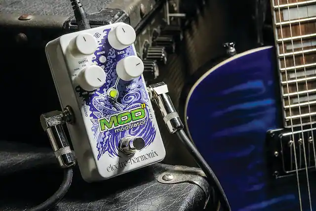 - MODE
- RATE
- DEPTH
- VOLUME
- COLOR
- HARM. VIB.
- TREM
- FILTER
- PITCH
- PHASE
- TIE
- TAP IN
- INPUT
- OUTPUT
- MOD
- MODULATOR
- ELECTRO-HARMONIX